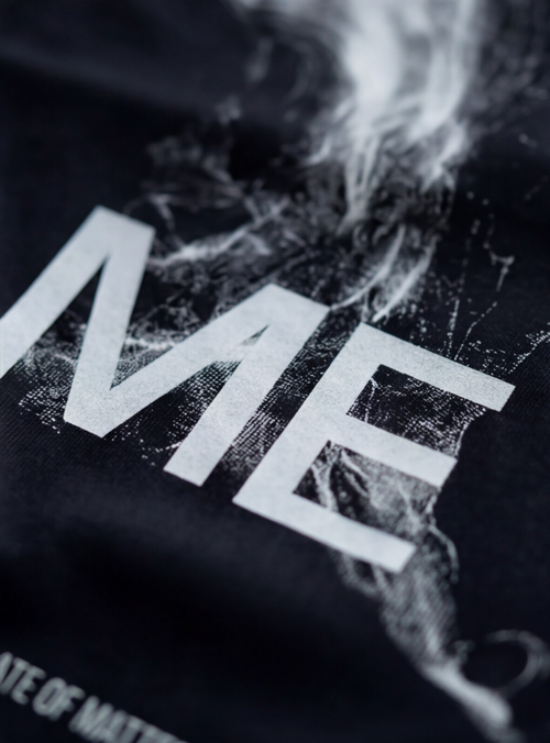 LOSE ME tee — extreme close-up of the dissolving figure print, white on black